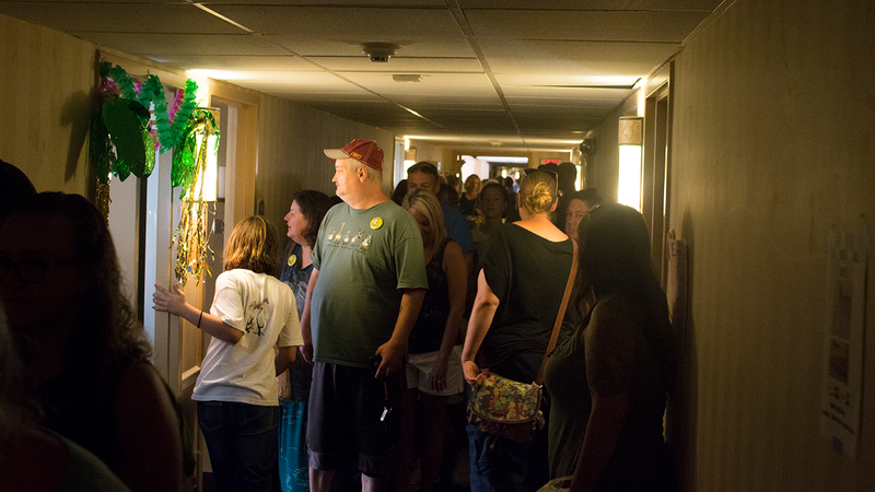 First floor of the Clarion Inn, Friday night, packed with potential buyers.